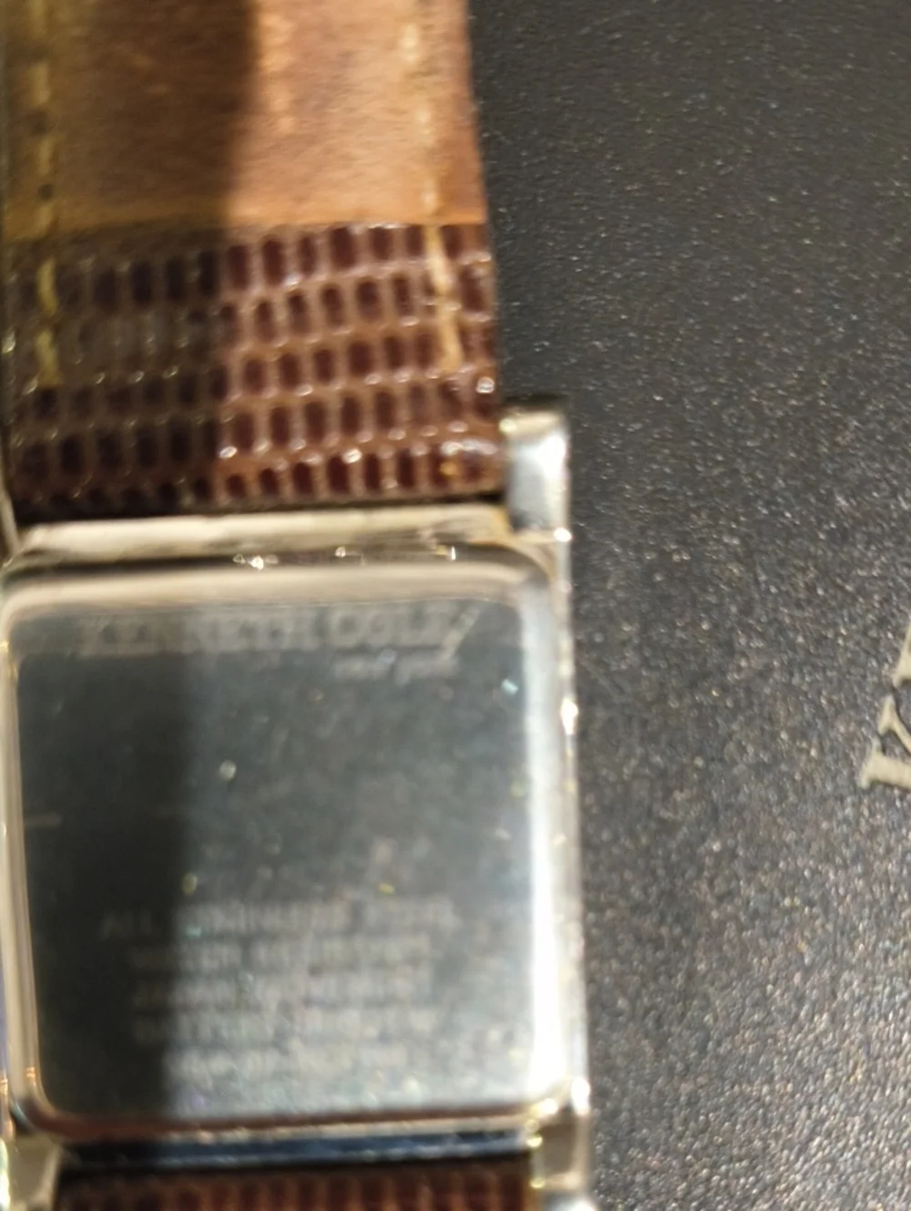 Kenneth Cole New York Ladies Silver Case Watch with Brown Lizard Style Band Cool